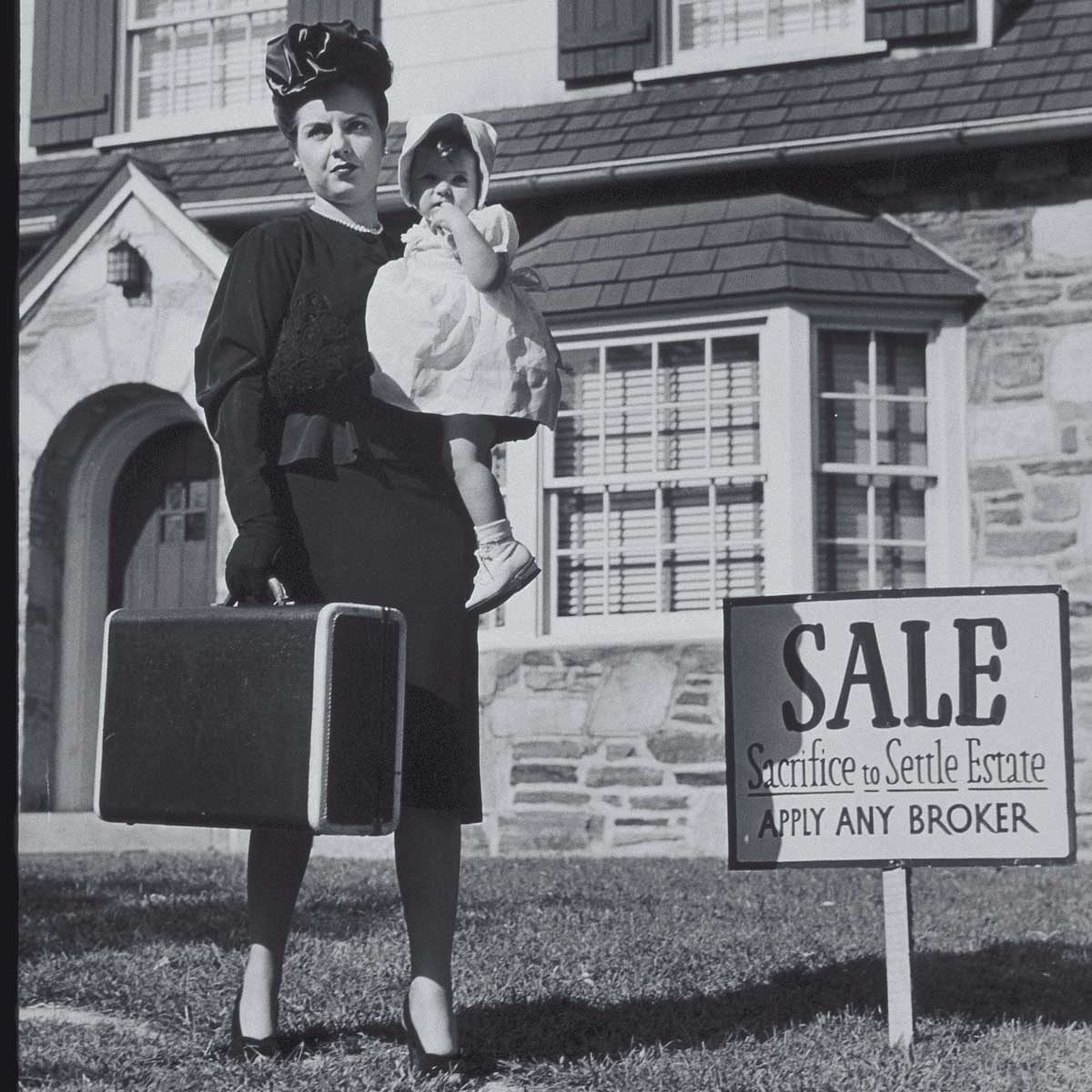 A woman holds a suitcase and child, standing in front of a house with a "SALE" sign stating "Sacrifice to Settle Estate. Apply Any Broker."