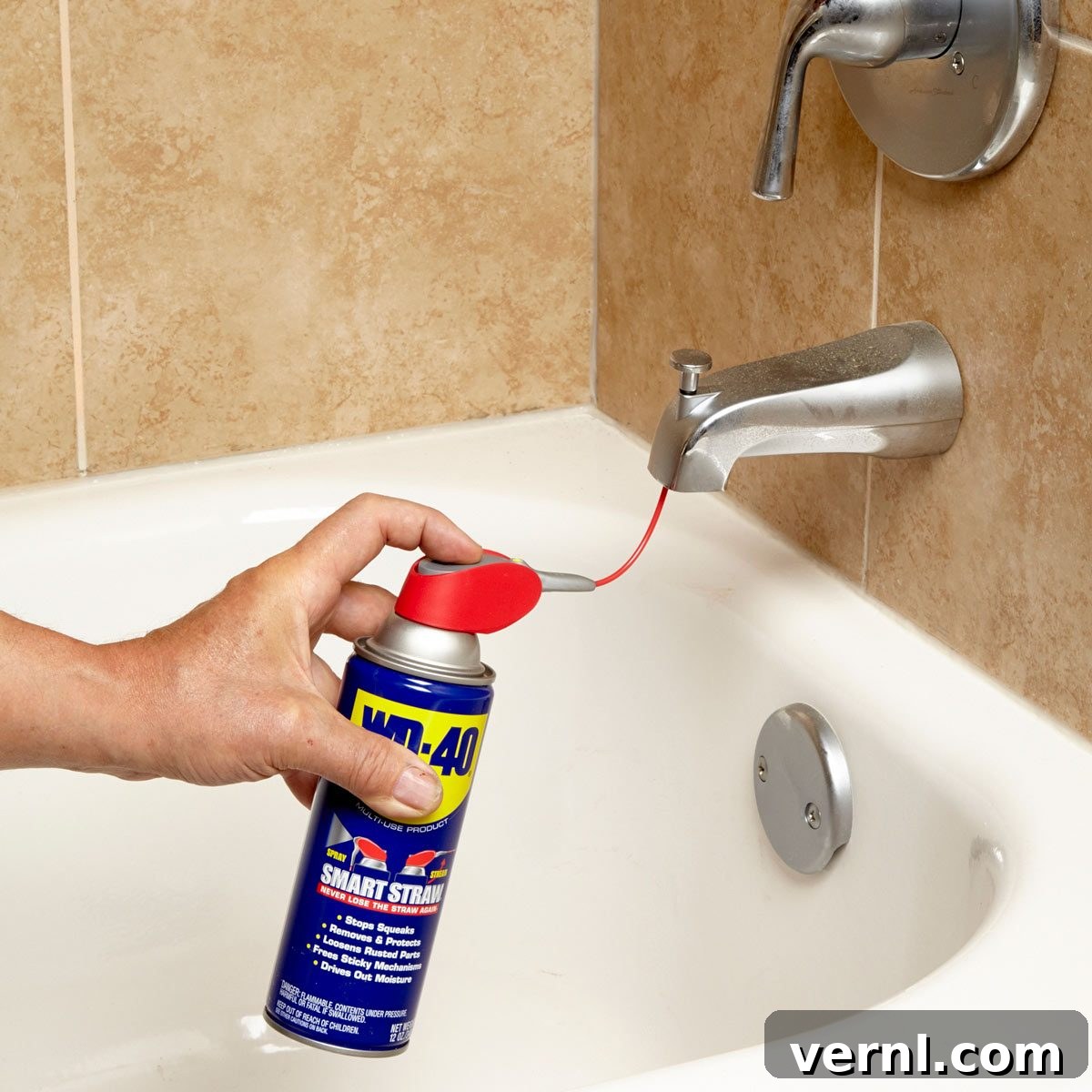 Unstick Your Tub Spout Diverter 2 Man applying WD-40 to tub spout diverter