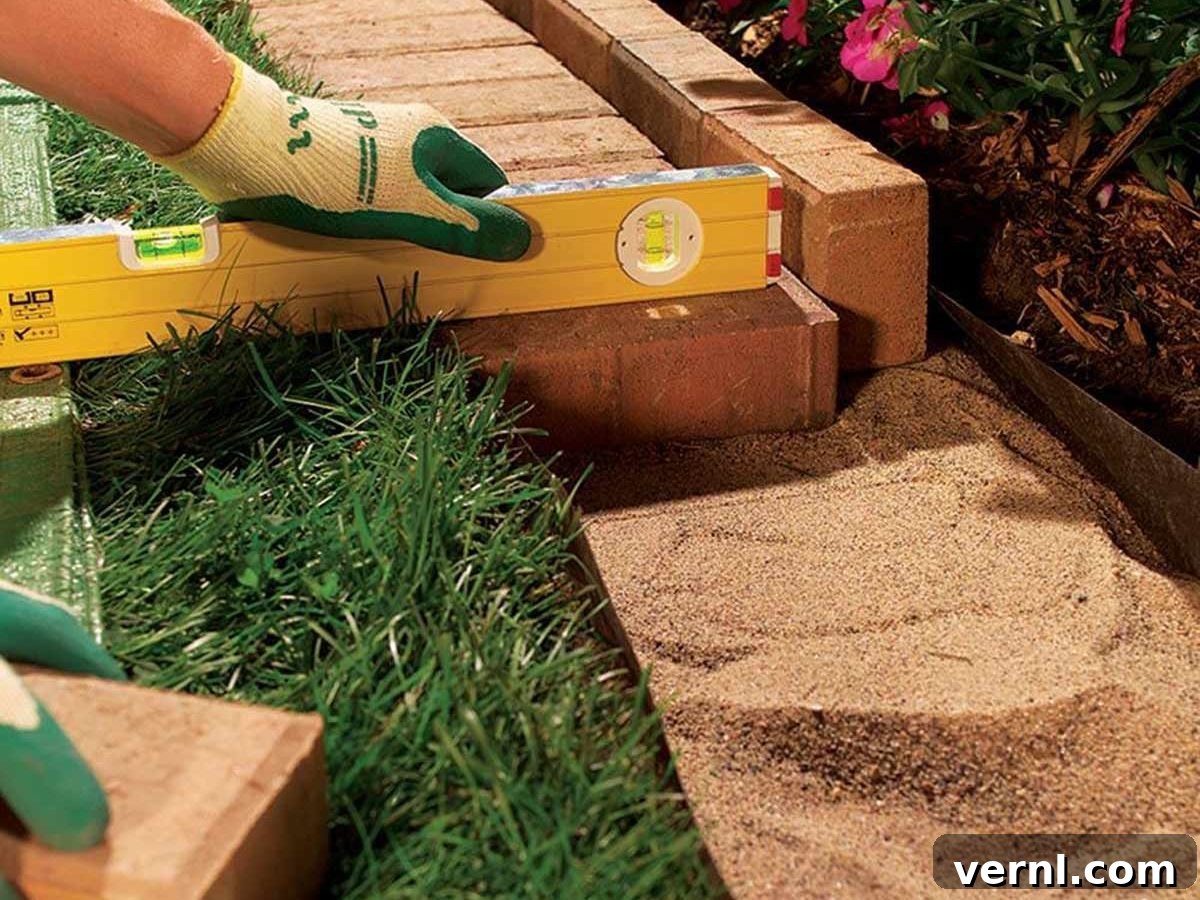 Garden Edging: The Simple Secret to a Stunning Landscape 5 Elegant brick pavers meticulously laid to create a timeless and solid edge for a landscaped garden area.