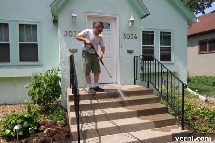 UGL NuDeck Concrete Solutions 4 Pressure washing concrete stairs to remove dirt and grime before coating.