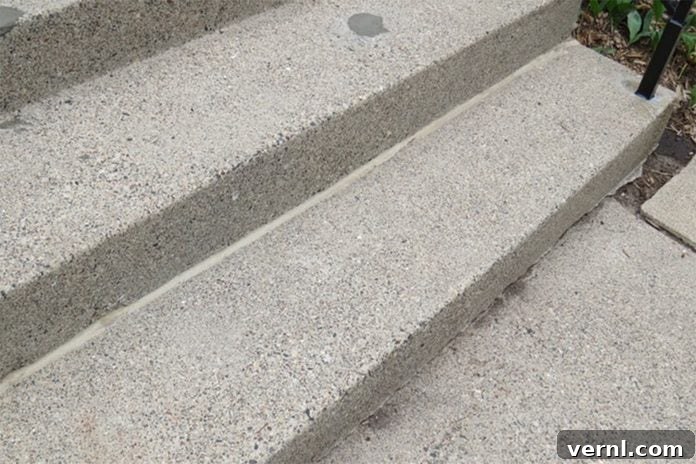 UGL NuDeck Concrete Solutions 6 Repaired crack between a concrete stair tread and riser, previously caulked.