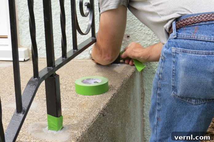 UGL NuDeck Concrete Solutions 8 Painter's tape applied to surfaces adjacent to concrete stairs for protection.