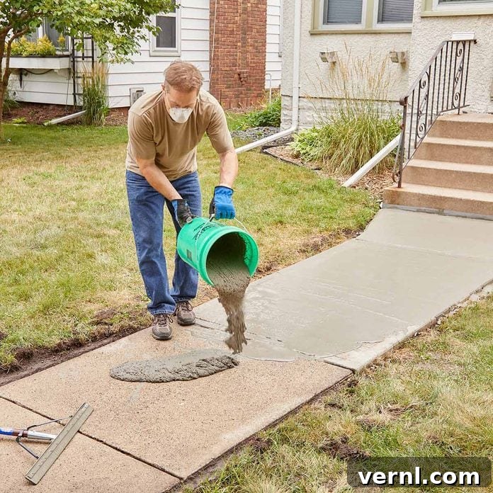 DIY Sidewalk Transformation: Easier Than You Imagine 11 Continuously pouring and spreading Sakrete Flo-Coat to coat the entire sidewalk