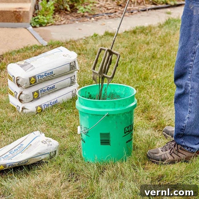 DIY Sidewalk Transformation: Easier Than You Imagine 8 Mixing Sakrete Flo-Coat Concrete Resurfacer with a heavy-duty drill and paddle