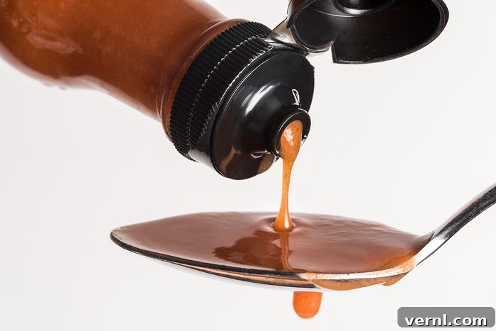 Protect Your Porch Pumpkins from Squirrels 4 Close Up Of Bottle Pouring Hot Sauce In Spoon Against White Background