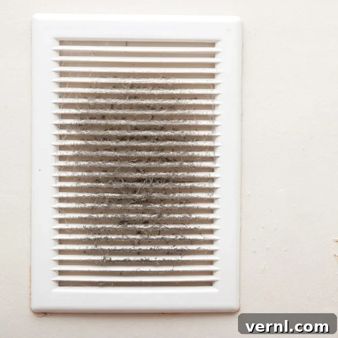 Vent grilles and dust, illustrating the normal dusty smell emitted when a furnace starts for the first time after summer.