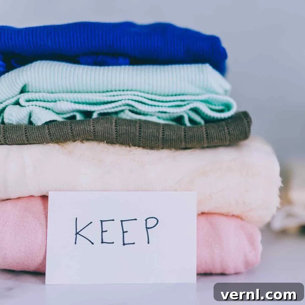 Declutter Once Enjoy Forever 3 piles-of-tshirts-and-clothes-being-sorted-into-Keep-Discard-and-Donate-categories