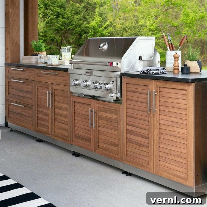 Outdoor Kitchen Canopy with Storage 9 Sleek outdoor kitchen setup with modern cabinets and appliances.