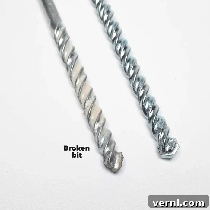 Rotary vs. Hammer Drills: Picking the Right Tool 11 Illustrating a broken drill bit, cautioning against applying excessive pressure during drilling
