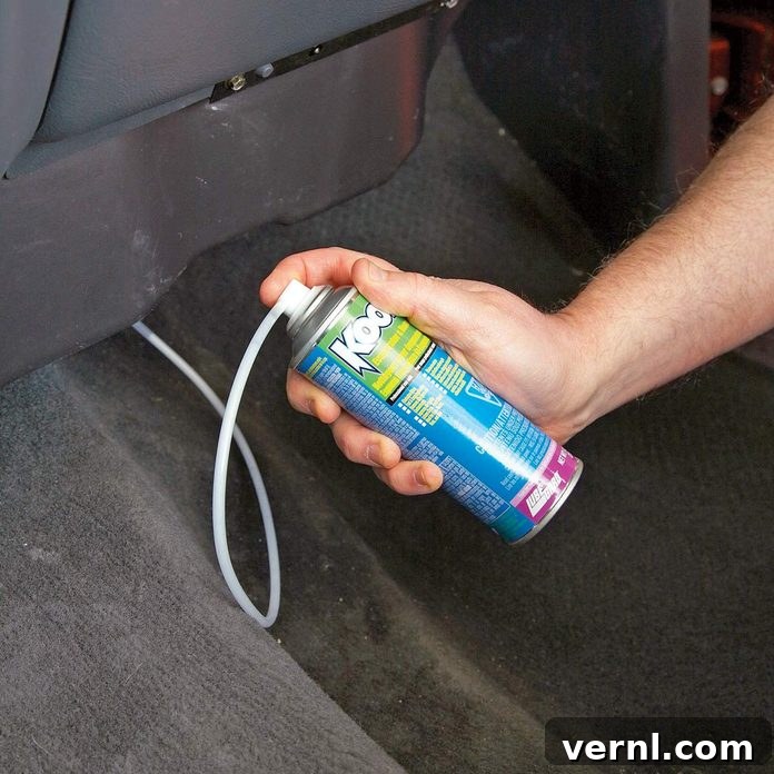 Injecting-mold-killing-foam-into-car-AC