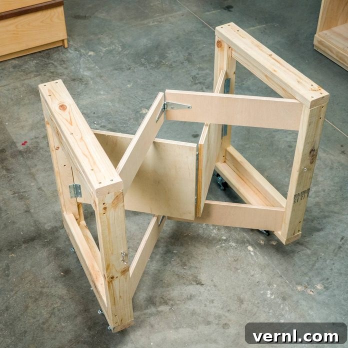 Folding mobile workbench offering flexible workspace in a garage
