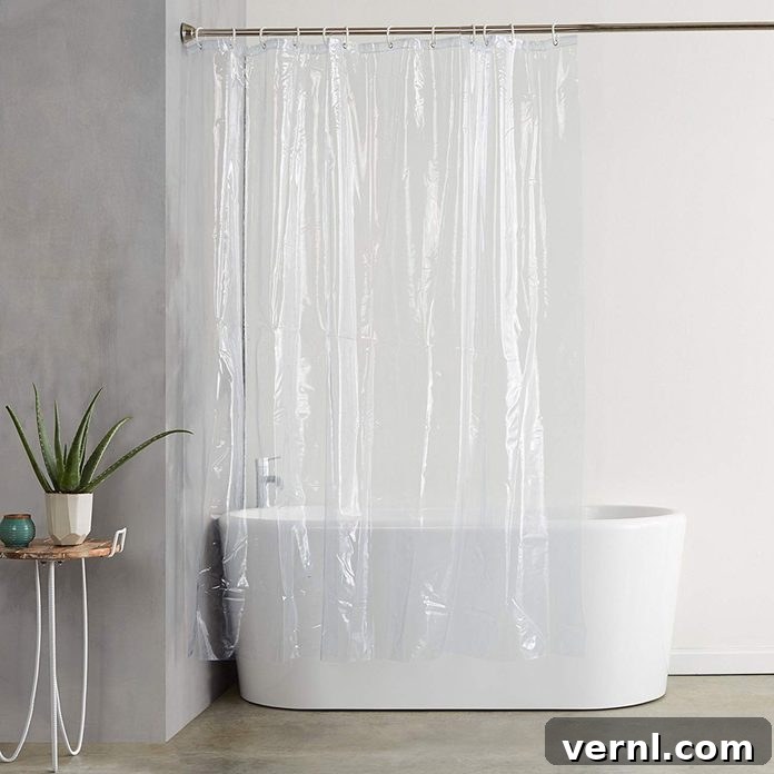 A pristine, clean plastic shower curtain liner, indicating freshness and hygiene in a modern bathroom.
