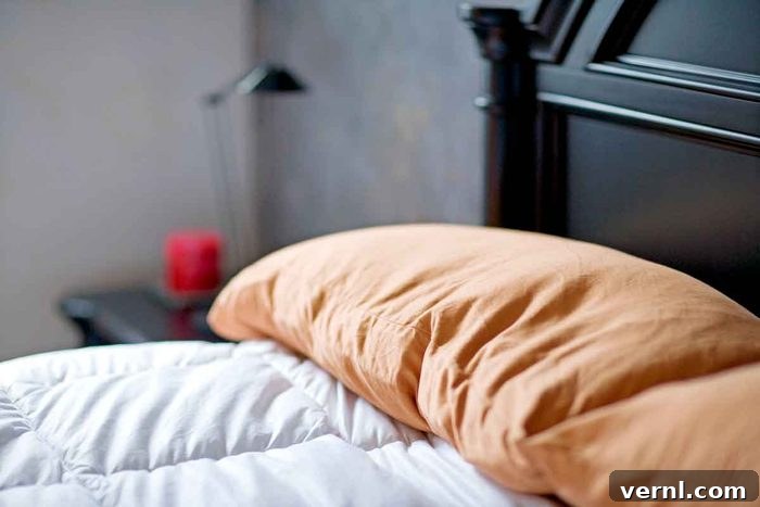 Cozy bedroom with a made bed and natural light, depicting a space typically considered safe and private.