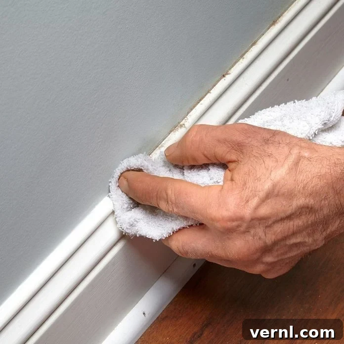 Simple Steps for Sparkling Baseboards 2 fh14may_548_07_011 surface cleaning on baseboards dusting