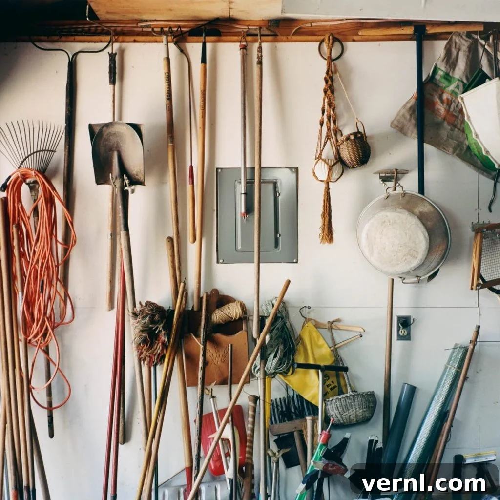 From Lint Trap to Lush Landscape Repurpose Dryer Lint for Your Garden 7 Various well-maintained garden tools neatly organized on a pegboard in a clean garage workshop