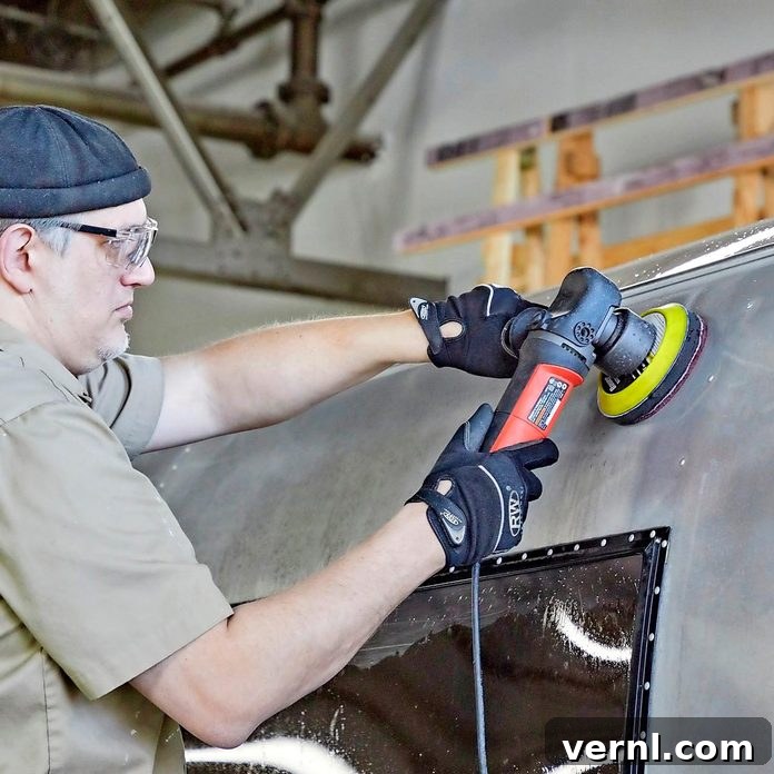 The Camper's Grand Comeback: From Junk to Jewel 2 buffing exterior of camper