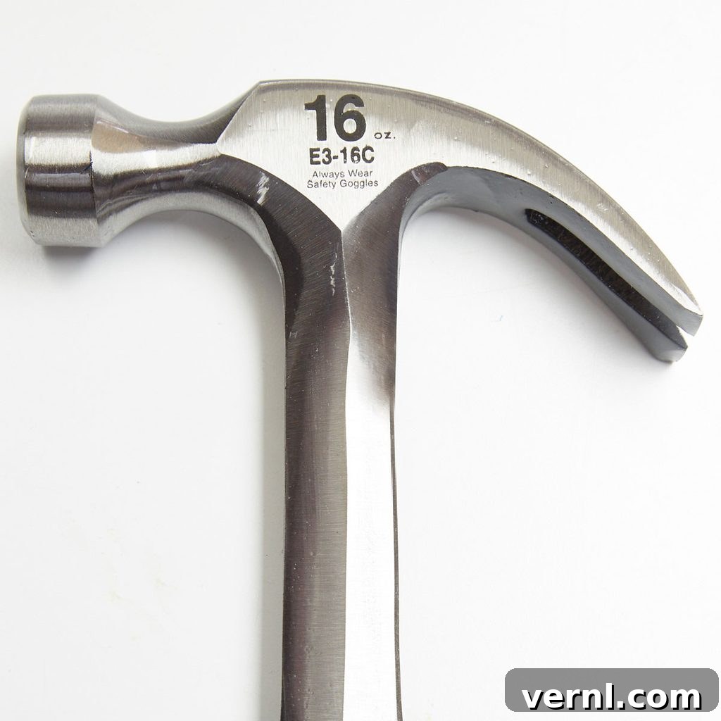 Hammer Claw Showdown Curved or Straight 3 A curved hammer head, highlighting its nail-pulling arc and compact design for easy nail extraction