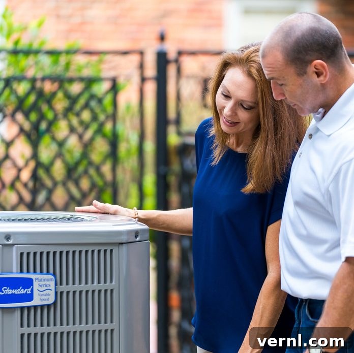 Mastering HVAC Ownership 2 Two people checking out an air conditioner
