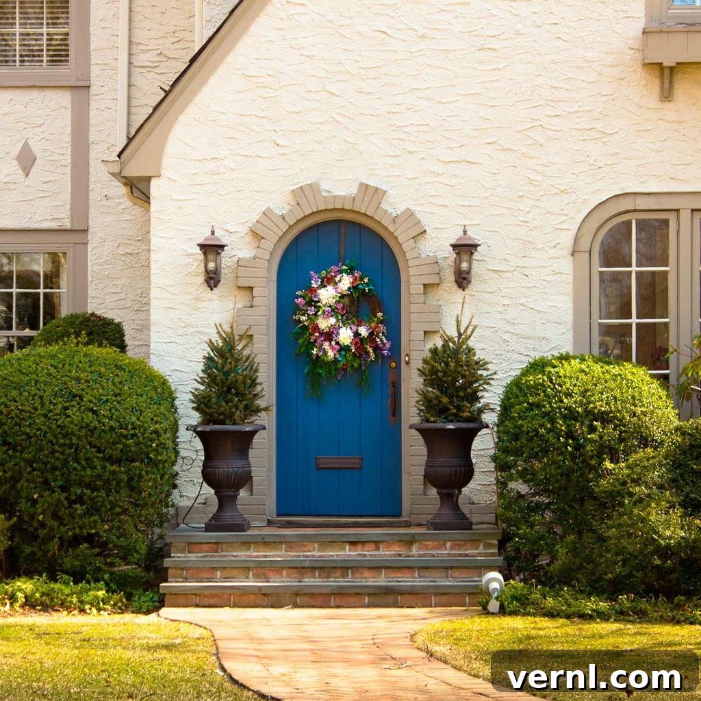Choosing Siding: 9 Options for Your Home 7 blue front door on stucco home
