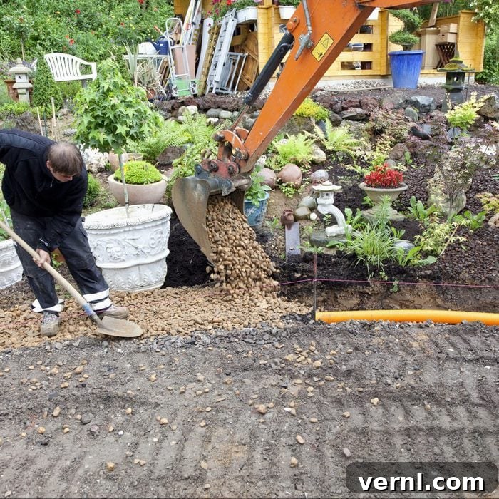 Your Guide to French Drains 2 placing rocks and gravel over french drain pipe system