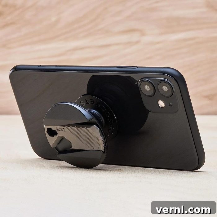 Your Phone's Next Essential Accessory The Back Mounted Multi Tool 2 The PopSockets PopGrip SOG Multi-Tool attached to a smartphone, showcasing its compact design and integrated tool.
