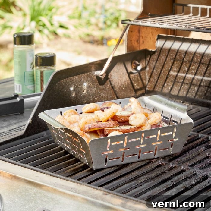 Weber's Grilling Basket: The Ultimate Tool for Vegetable Perfection 2 weber grill basket with shrimp and potatoes on a grill
