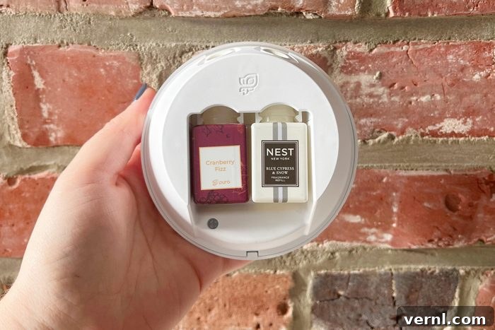 Pura Home Fragrance device displaying two scent vials