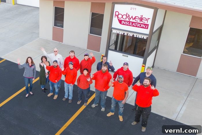 Renee Wilson An Eleven Percent Woman in Insulation 2 The Rockweiler Team Waving in the parking lot outside their building, showcasing a strong and unified construction workforce dedicated to quality insulation services.