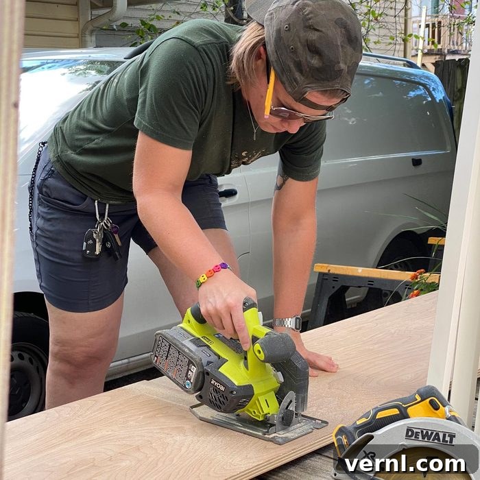 Kat Christie The Eleven Percent Solution For Home Repair 2 Kat using a saw and cutting wood