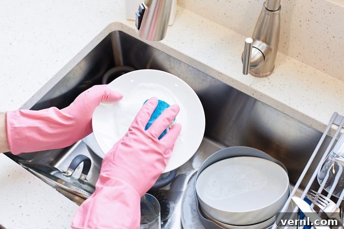 Your Ultimate Guide to a Spotless Kitchen 3 Person doing dishes, weekly house chores
