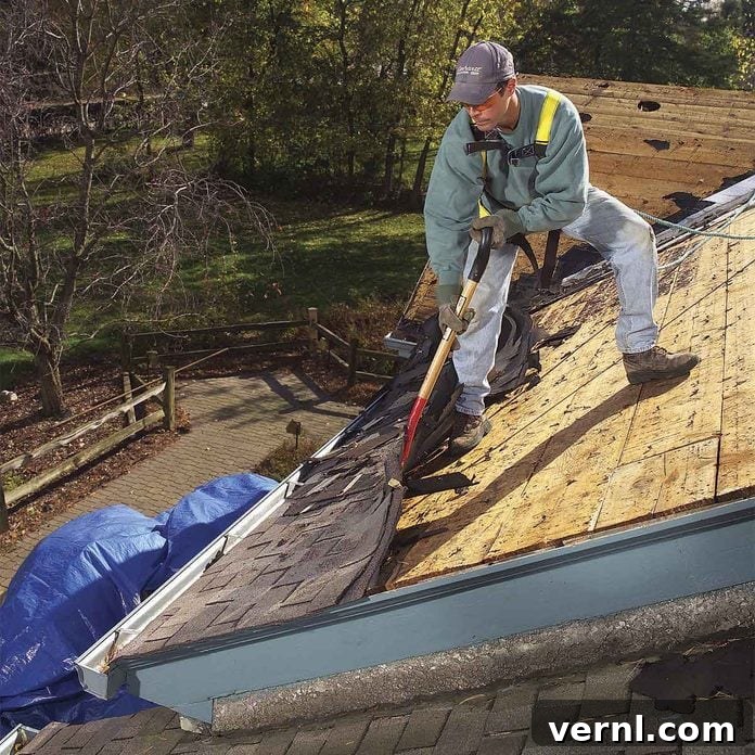 Bulletproof Your Roof: Fortify Your Home Against Any Storm 2 Inspecting and repairing roof shingles for damage