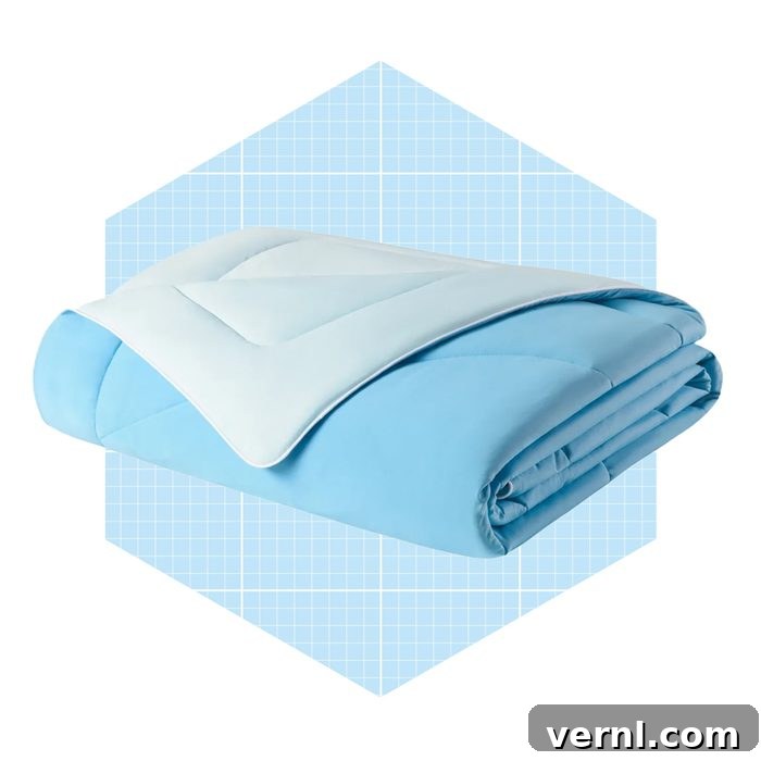 Evercool Comforter Review: Experience Cooler, More Restful Sleep 3 Cooling Comforter Draped Over Bed: A close-up shot of the Rest Evercool Cooling Comforter, showcasing its smooth texture and subtle sheen as it lays neatly on a bed, inviting a closer look at its quality and design.