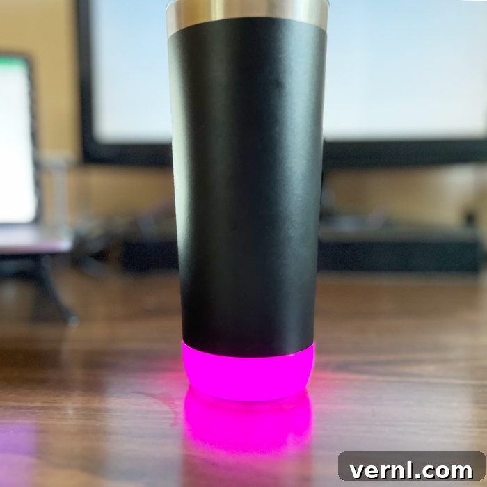 HidrateSpark Pro Smart Water Bottle Is It Worth The Hype 7 Hidratespark Proglowing pink on desk
