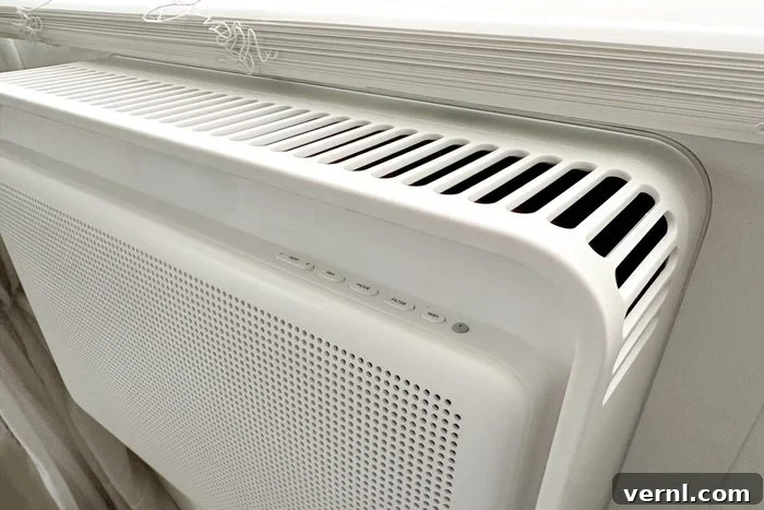 Windmill AC Window Unit: The Hype Is Deserved 4 The Windmill Air Conditioner's smart features being controlled via a smartphone app, highlighting its modern connectivity and user convenience.