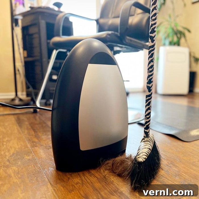 EyeVac Home Vacuum: Editor-Approved for Stubborn Pet Hair and Floor Dirt 2 Sweeping pet hair and debris into the EyeVac Home stationary vacuum