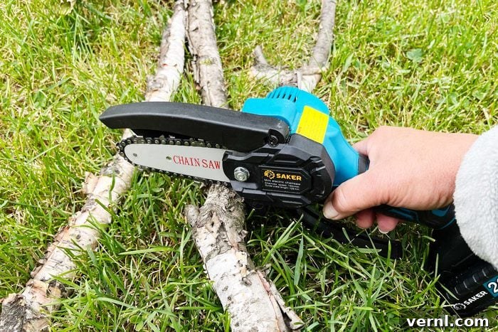 Saker Cordless Mini Chainsaw: One-Handed Power 4 Saker Mini Chainsaw cutting branches