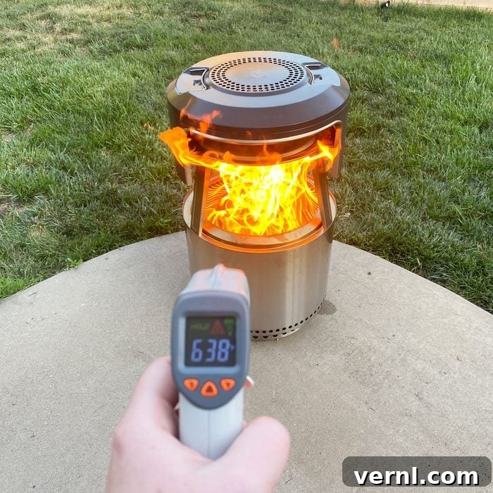 Solo Stove Pi Fire Review: The Ultimate Fire Pit Pizza Upgrade 4 testing the temperature of the Solo Stove Pi Fire