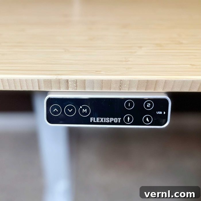 FlexiSpot E7 Pro Standing Desk in a modern home office setting with green plants