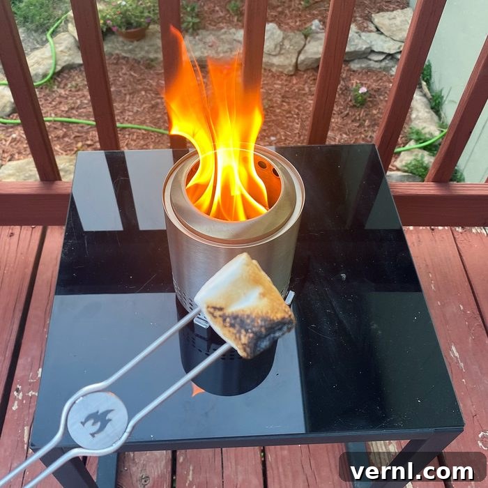 Solo Stove Mesa Transform Your Patio with This Portable Fire Pit 4 Solo Stove Mesa and a marshmallow being roasted