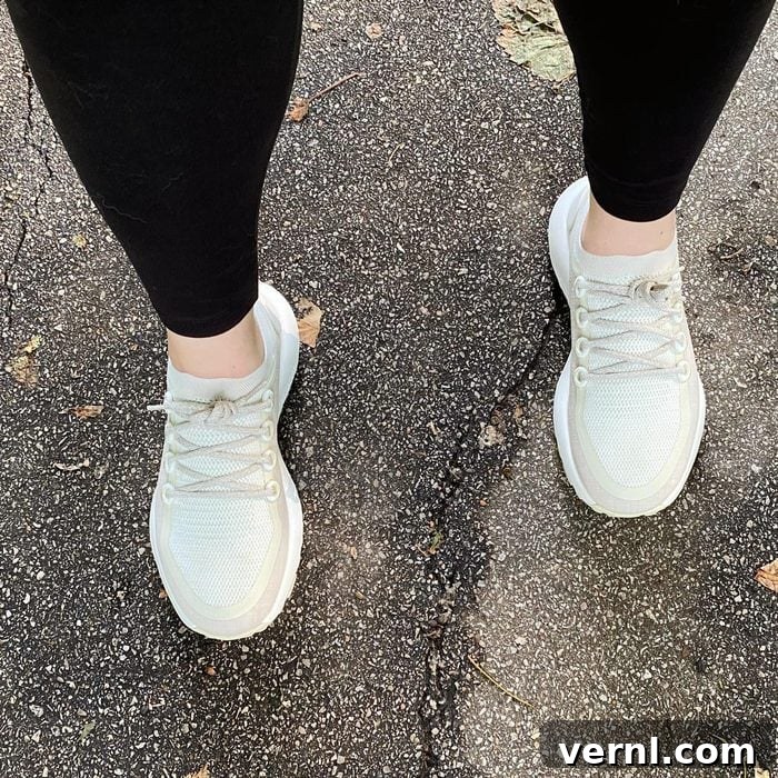 Allbirds Trail Runner walking on pavement, showcasing its sleek design and ready-for-action profile.