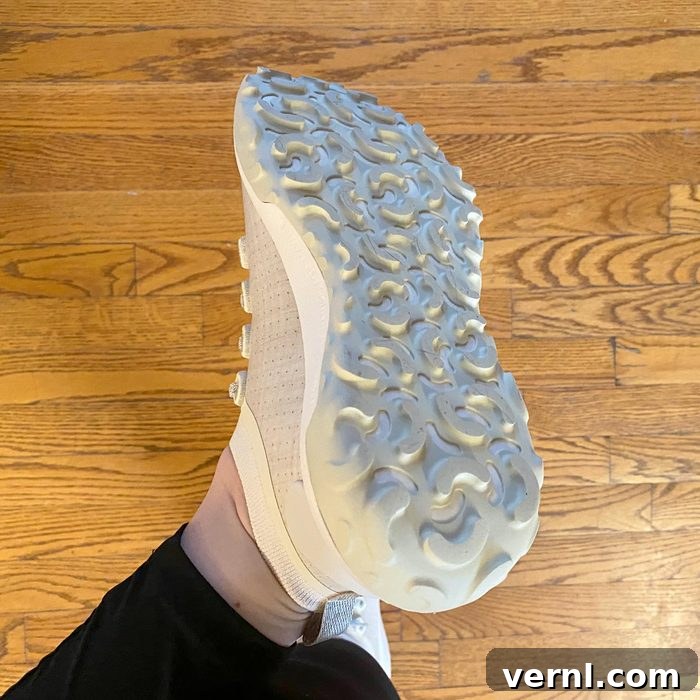 Close-up of the bottom of an Allbirds Trail Runner shoe, highlighting the unique tread pattern for grip.