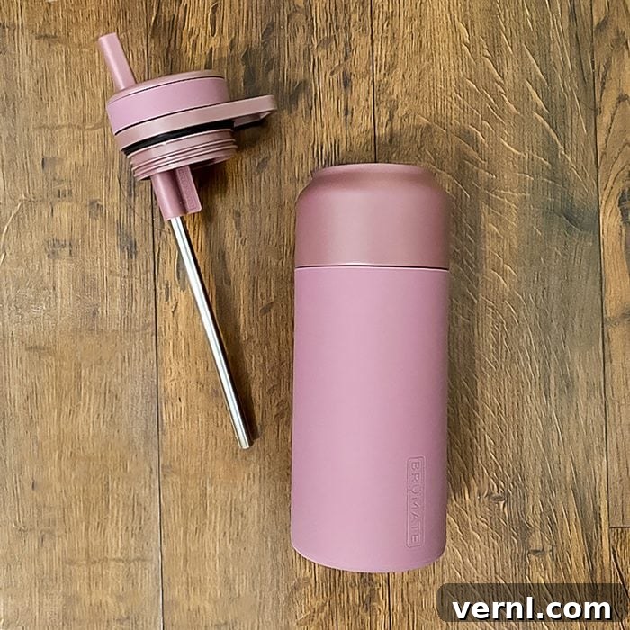 Brumate Rotera Review: The Leak-Proof Bottle That Actually Works 3 Brumate Rotera Water Bottle with Tumbler on Wooden Surface, highlighting design and features