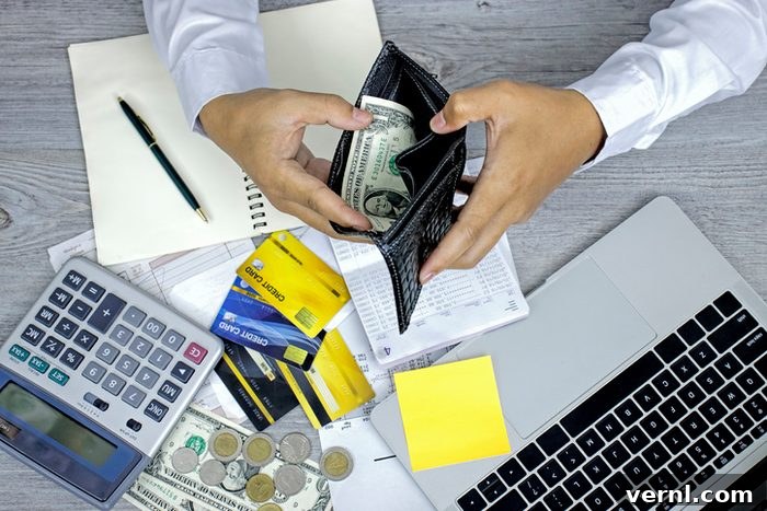 HELOC Versus Home Equity Loan Choosing the Best Option 2 Man hands opening wallet at the table in managing home finances with credit cards, cash and bills