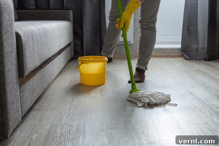 Cleaning Hardwood Floors with a Bucket and Mop for a House Cleaning Concept