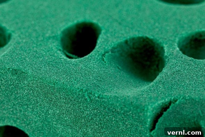 Sustainable Blooms: Mastering Foam-Free Flower Arrangements 2 A used Green Floral Foam sponge Brick, isolated background