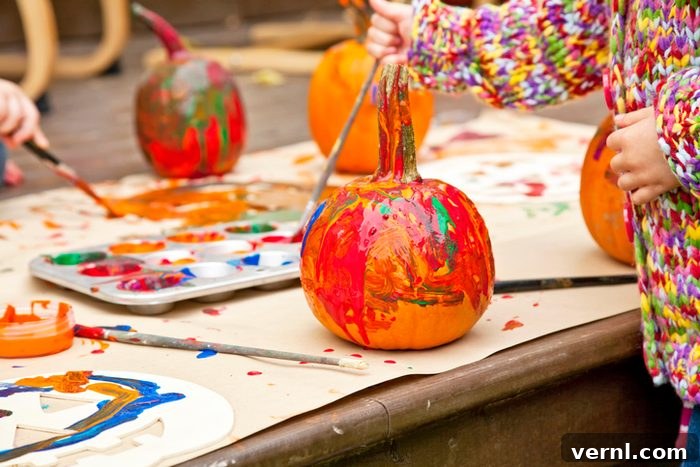 The Best Paints for Halloween Pumpkin Decorating 2 Pumpkins colorfully painted by children.