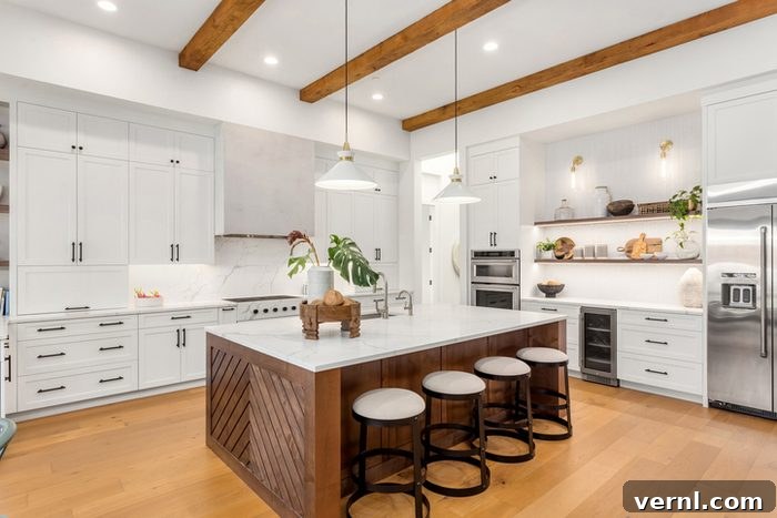 The Understated Elegance of Quiet Luxury Redefining Home Interiors 2 beautiful kitchen in new luxury home with island, pendant lights, and hardwood floors.