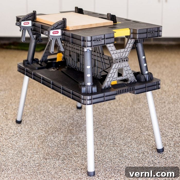 Keter Folding Work Table: A Professional Woodworker's Shop Floor Test 3 Close-up of the Keter Folding Work Table's clamping system and guide rails, highlighting its functional design.