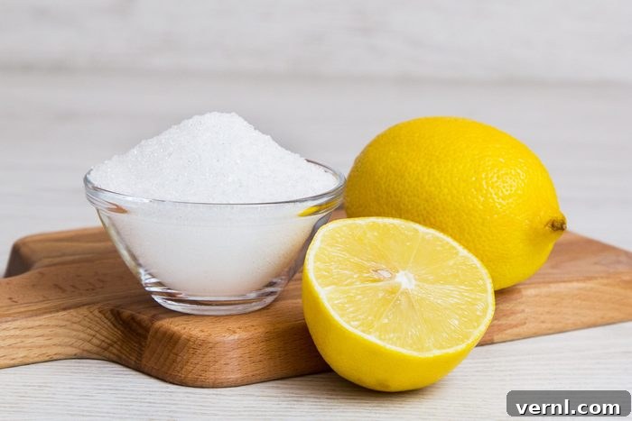 Reclaim Your Bathroom From Rust Stains 2 salt and lemons on a wooden cutting board