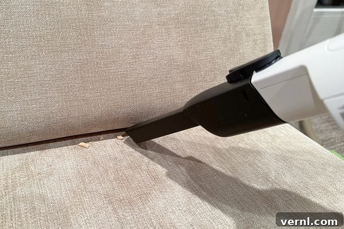 Shark Cordless Pro: The Vacuum That Cleans Up After Itself 6 Shark Cordless Pro Vacuum used for cleaning couch